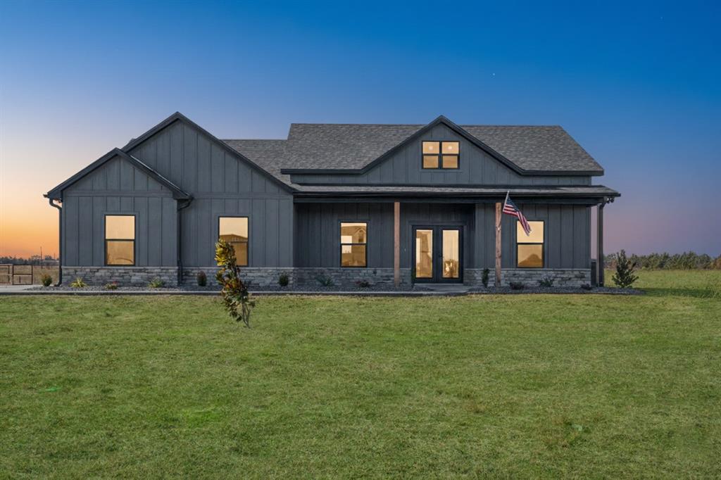 213 Private Road Sumner, TX 75486 - Photo 2 of 19 a front view of a house with garden