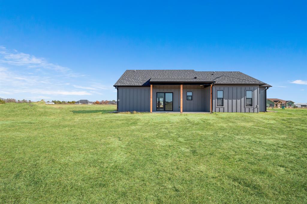 213 Private Road Sumner, TX 75486 - Photo 3 of 19 a front view of a house with a garden