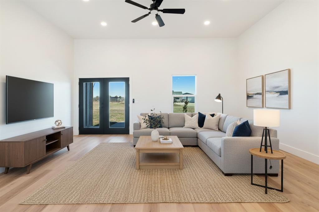 213 Private Road Sumner, TX 75486 - Photo 5 of 19 a living room with furniture and a flat screen tv