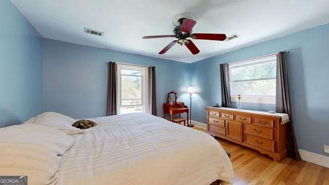 a bedroom with a bed and a fireplace