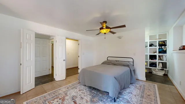 a view of a swimming pool and lounge chairs