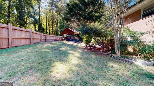 a view of a lake with a yard