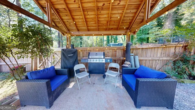 a view of a house with a yard and lake view