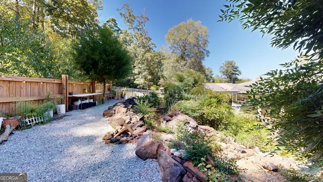 an aerial view of multiple houses with yard