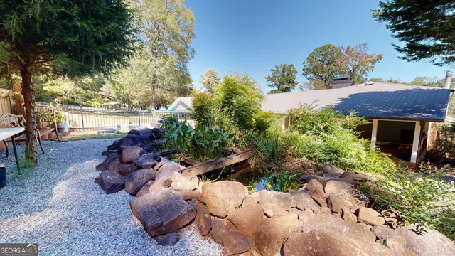 a view of swimming pool with a yard