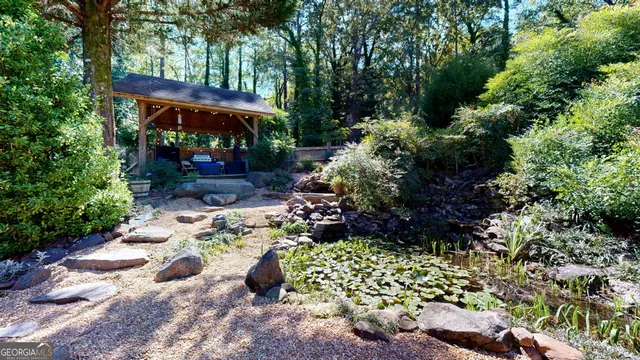 a dining room with furniture a fireplace and wooden floor