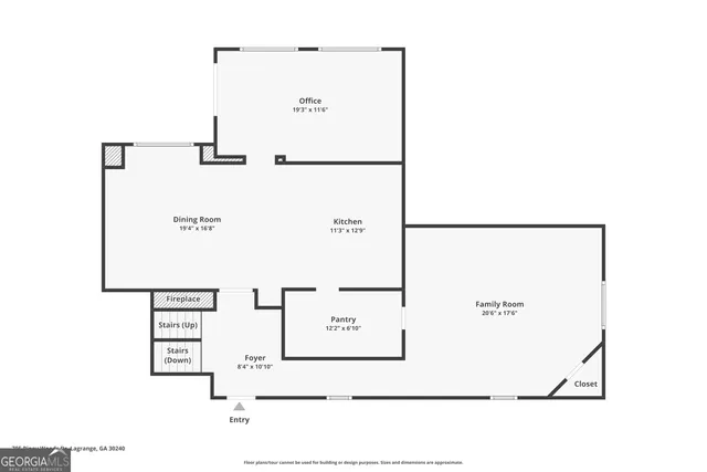 a kitchen with stainless steel appliances kitchen island a table and chairs in it