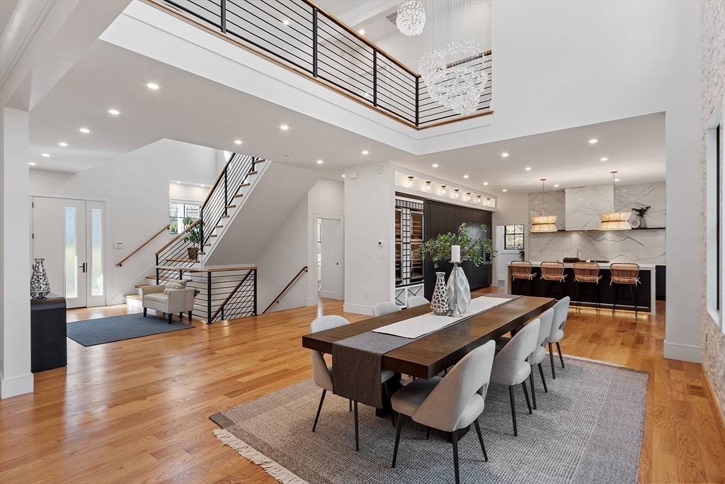 a dining room with furniture and wooden floor