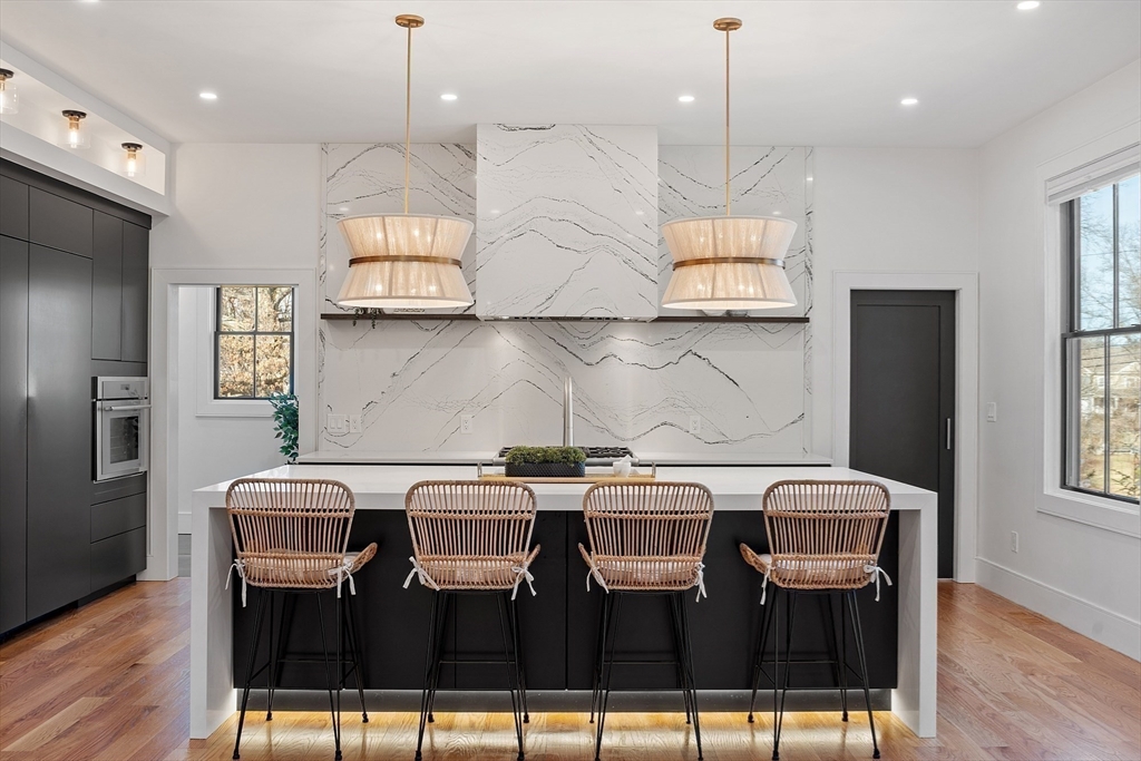 38 Webster Road Lexington, MA 02421 - Photo 11 of 42 a view of kitchen with granite countertop cabinets table and chairs