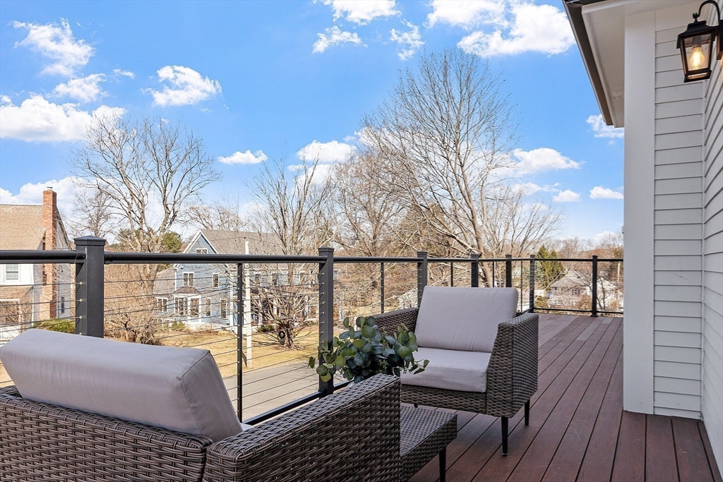 38 Webster Road Lexington, MA 02421 - Photo 26 of 42 a view of a balcony with wooden chairs