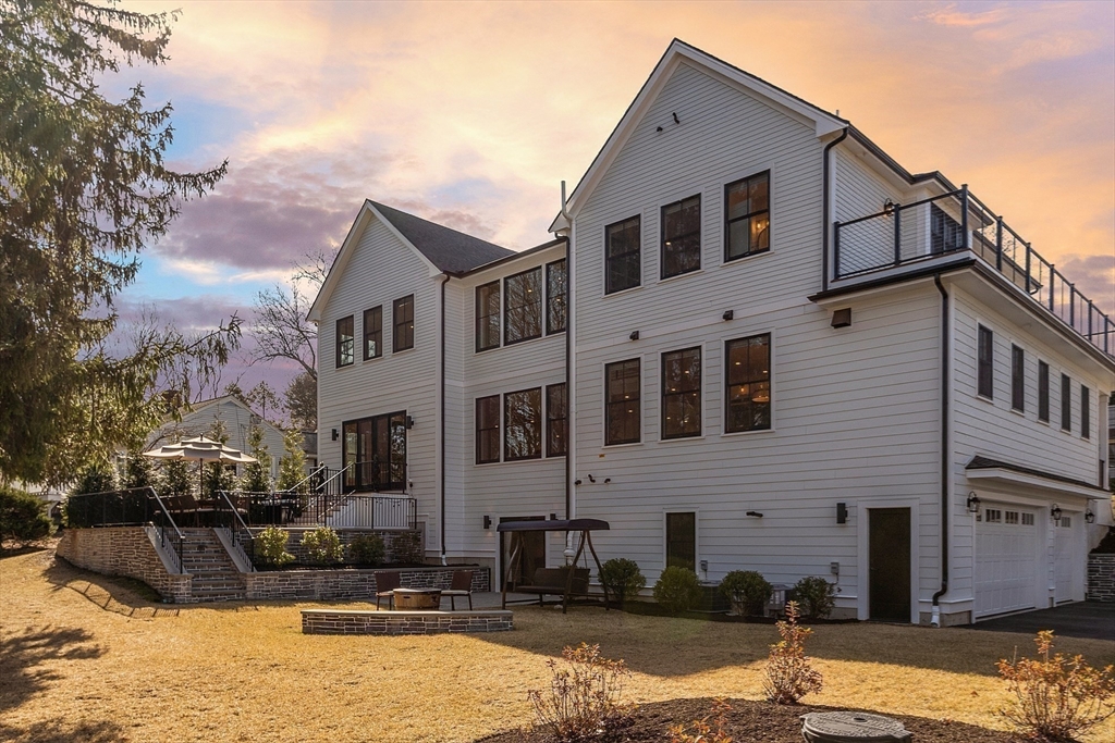 38 Webster Road Lexington, MA 02421 - Photo 42 of 42 a front view of a house with a yard covered with snow