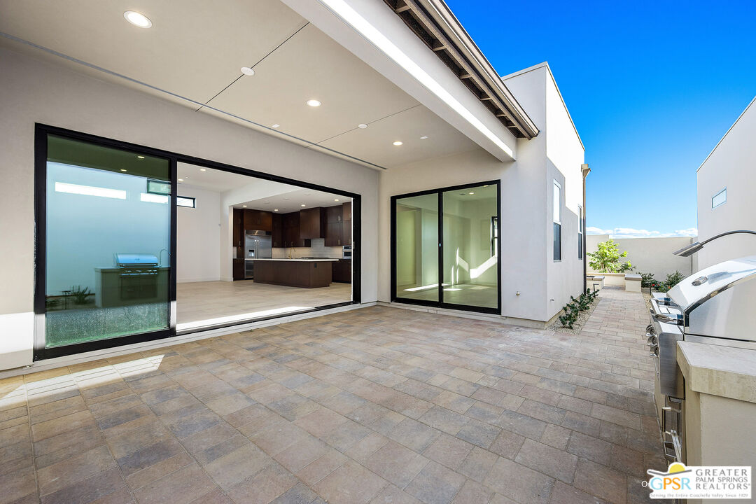 4 Heliotrope Avenue, Unit LOT #299 Rancho Mirage, CA 92270 - Photo 12 of 18 a view of a hallway with wooden floor and a fireplace