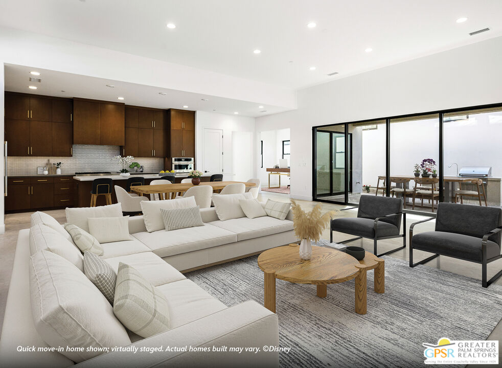 4 Heliotrope Avenue, Unit LOT #299 Rancho Mirage, CA 92270 - Photo 2 of 18 a living room with furniture kitchen view and large windows