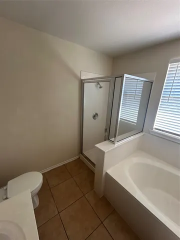 a bathroom with a sink a toilet and tub