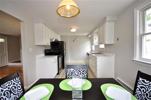 39 George Road, Unit 39 Winchester, MA 01890 - Photo 8 of 23 a view of a kitchen area with furniture and wooden floor