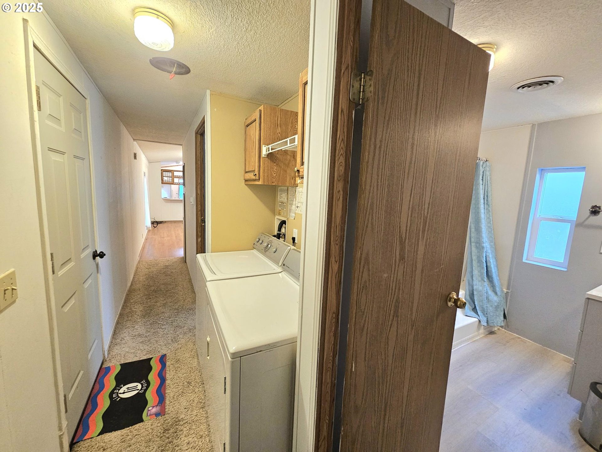 612 North Cascade Drive, Unit 25 Woodburn, OR 97071 - Photo 7 of 17 a view of hallway with wooden floor