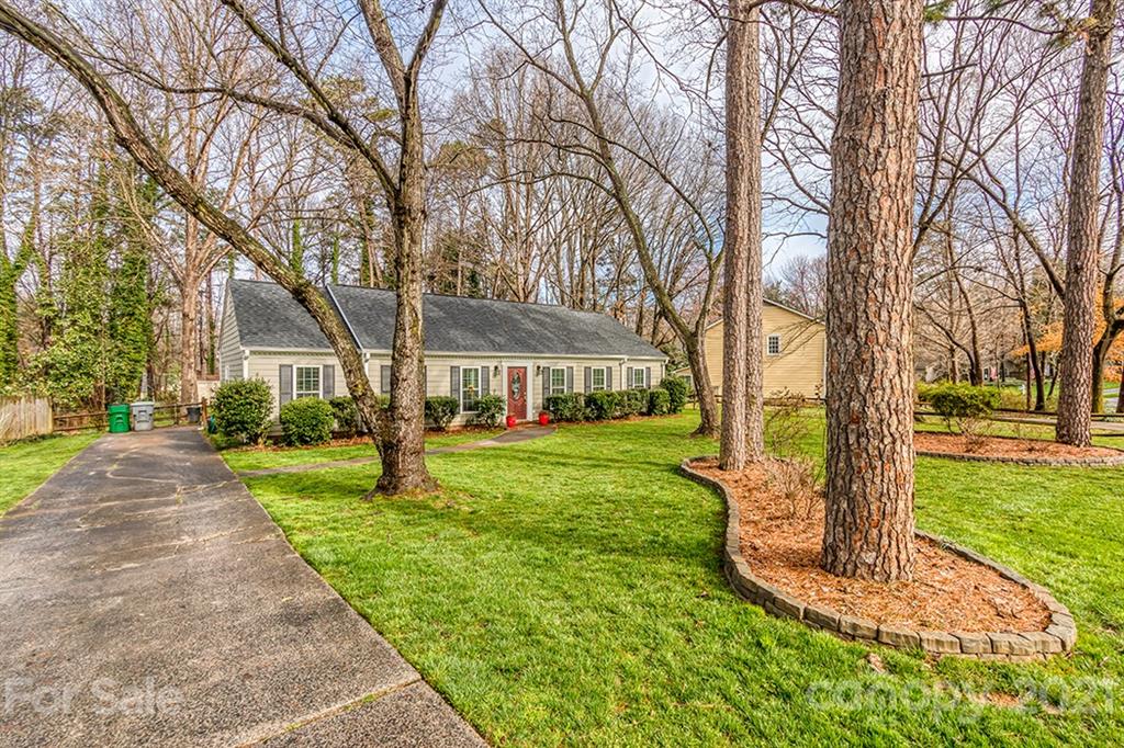 9638 Watergate Road Charlotte, NC 28270 - Photo 2 of 25 a front view of a house with garden