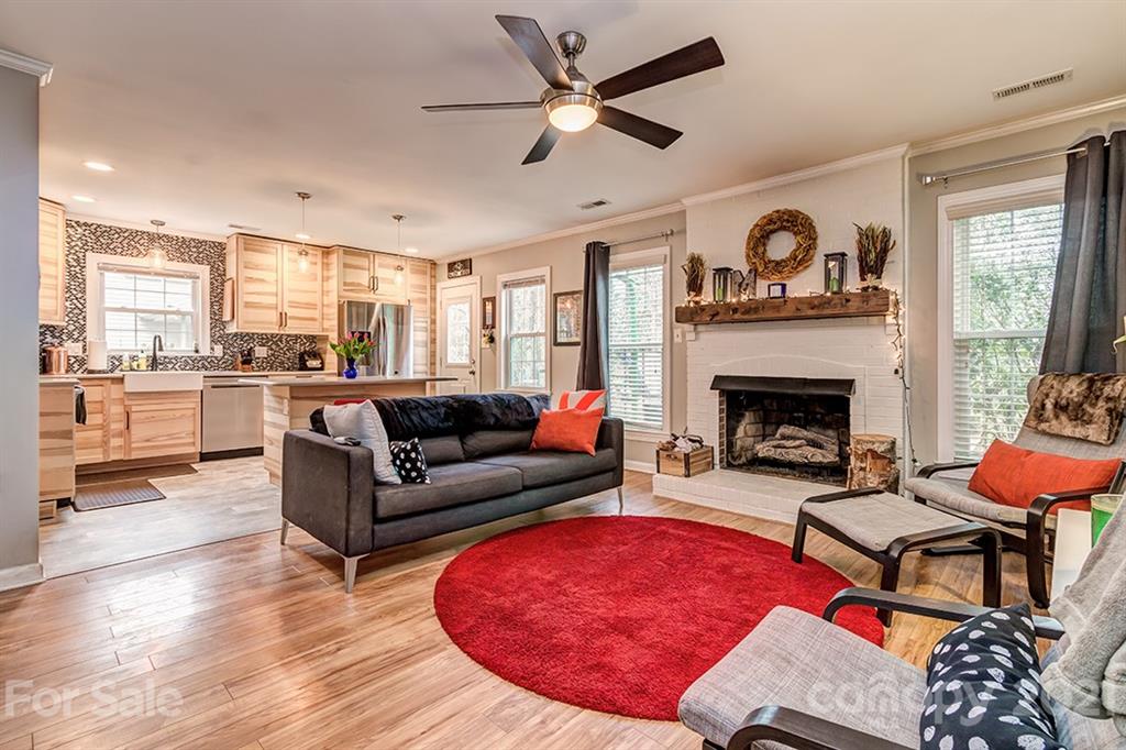 9638 Watergate Road Charlotte, NC 28270 - Photo 12 of 25 a living room with furniture and a fireplace