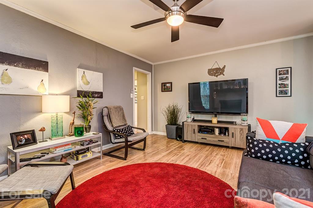 9638 Watergate Road Charlotte, NC 28270 - Photo 14 of 25 a living room with furniture and a flat screen tv