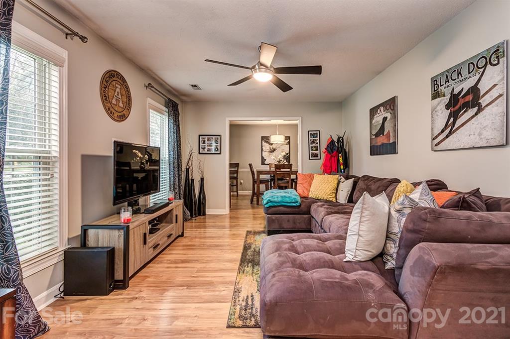 9638 Watergate Road Charlotte, NC 28270 - Photo 5 of 25 a living room with furniture and a flat screen tv