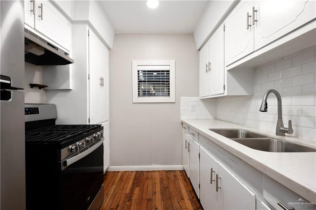 309 South 4th Street McAllen, TX 78501 - Photo 11 of 21 a kitchen with sink and cabinets