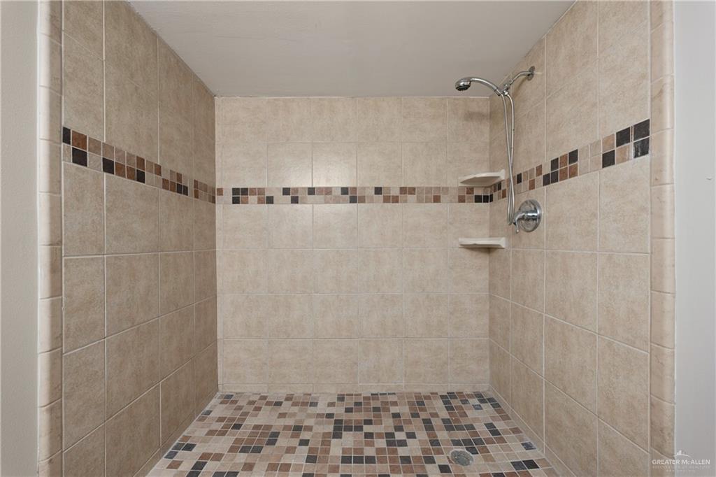 309 South 4th Street McAllen, TX 78501 - Photo 16 of 21 a bathroom with a shower