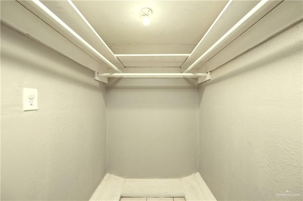 309 South 4th Street McAllen, TX 78501 - Photo 21 of 21 a bathroom with a white toilet