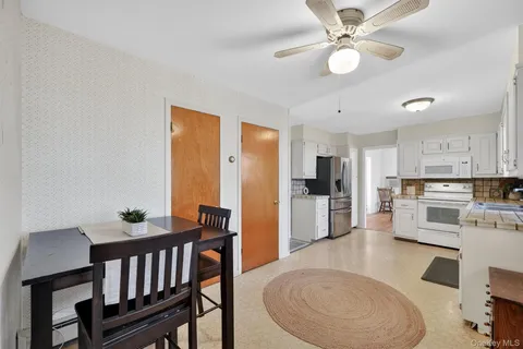 a dining room with furniture and window