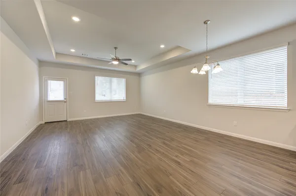 a kitchen with wooden floors and sink