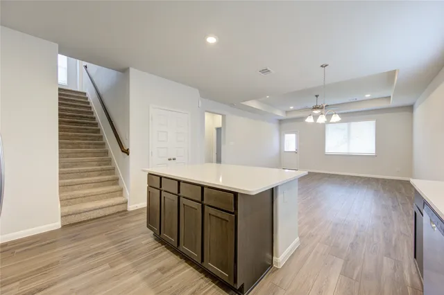 a kitchen with stainless steel appliances sink refrigerator and microwave