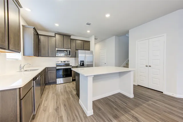 a bathroom with a double vanity sink and shower