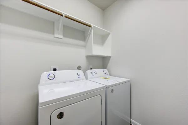 a view of a kitchen with a sink and a stove top oven