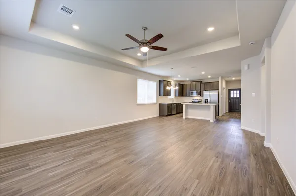 a view of an empty room with a window
