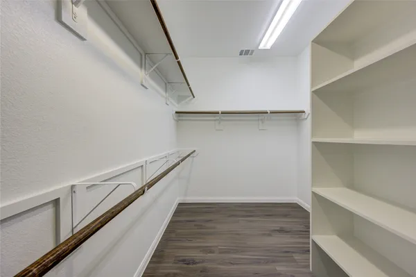 a view of an empty walk in closet