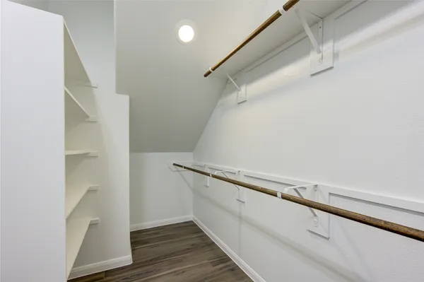 a bathroom with a shower and a sink