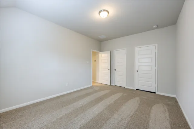 a view of swimming pool with yard in front of it