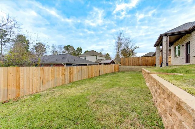 a view of a backyard with sitting area