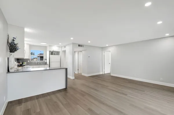 a view of kitchen with wooden floor