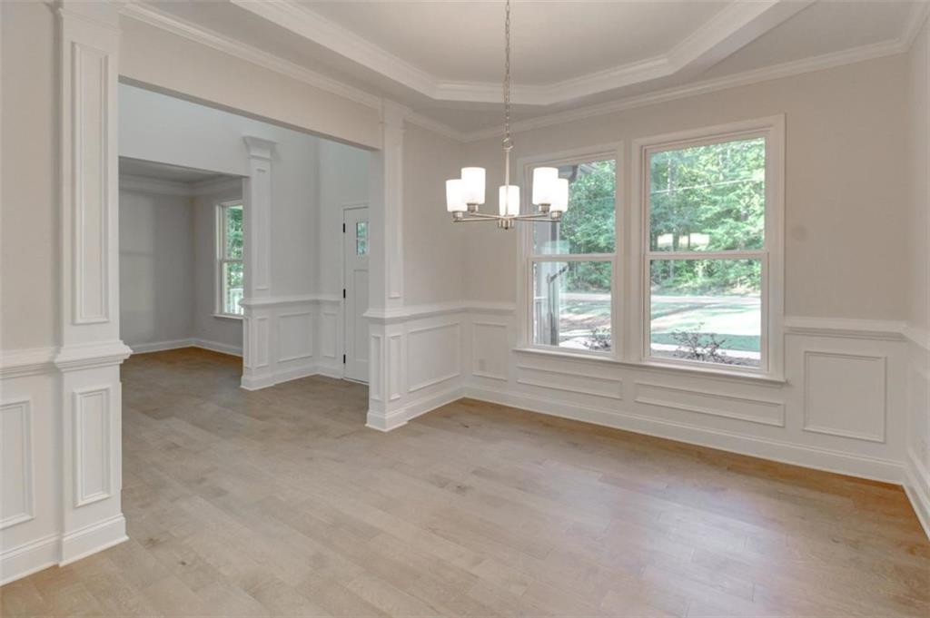 41 Woodland Road Covington, GA 30016 - Photo 11 of 35 an empty room with windows and outdoor view