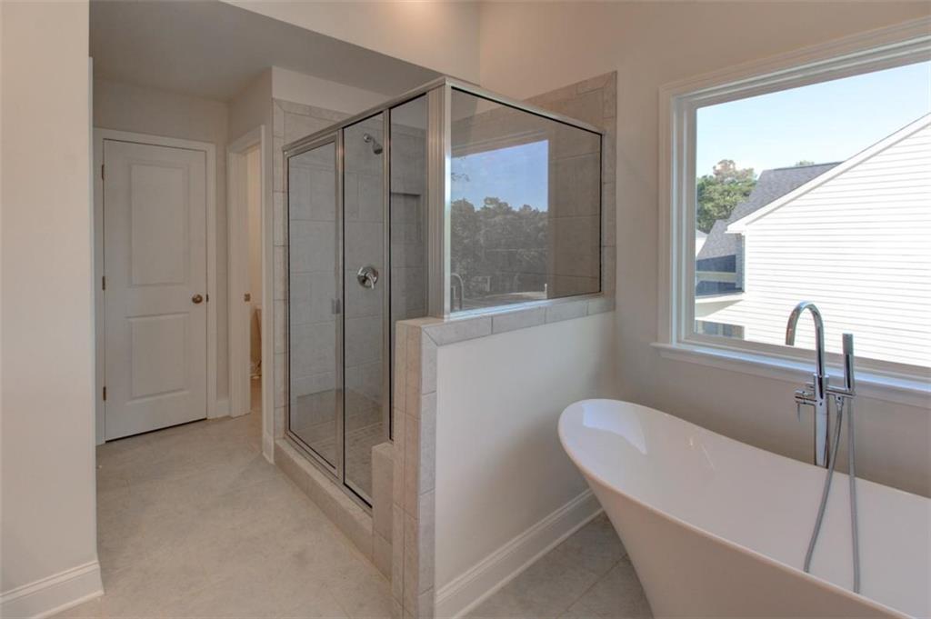 41 Woodland Road Covington, GA 30016 - Photo 26 of 35 a bathroom with a shower and a sink