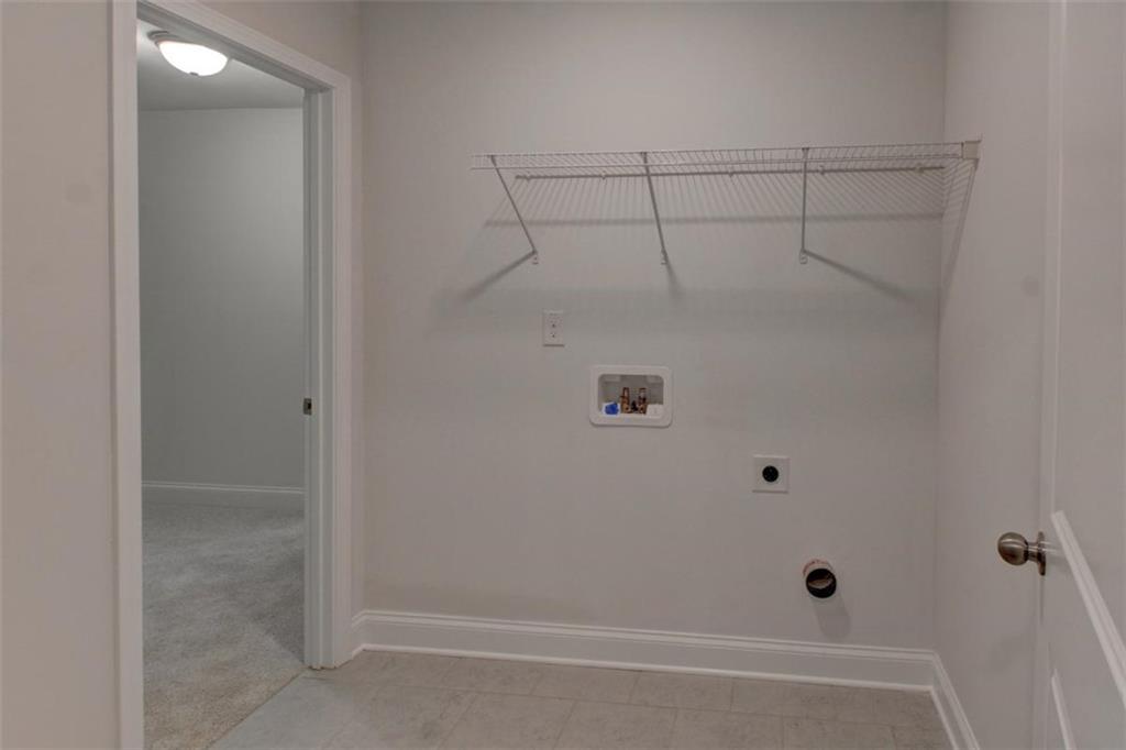 41 Woodland Road Covington, GA 30016 - Photo 30 of 35 a bathroom with a shower