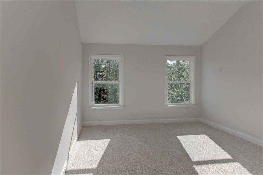 41 Woodland Road Covington, GA 30016 - Photo 33 of 35 an empty room with windows