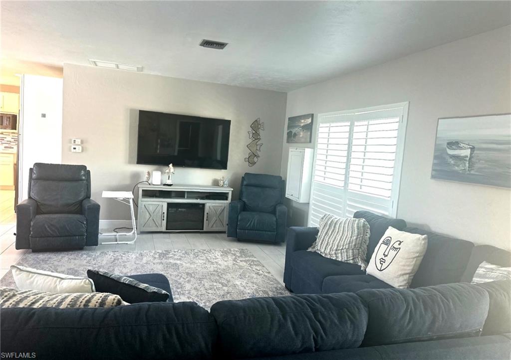 1263 North Collier Boulevard Marco Island, FL 34145 - Photo 2 of 4 Living area featuring light tile patterned floors