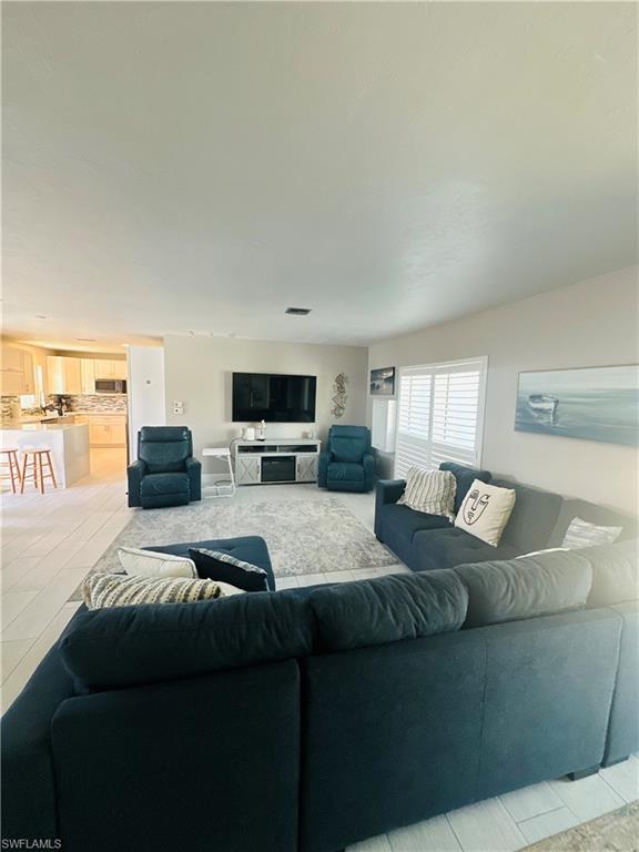 1263 North Collier Boulevard Marco Island, FL 34145 - Photo 3 of 4 Living room featuring light tile patterned flooring