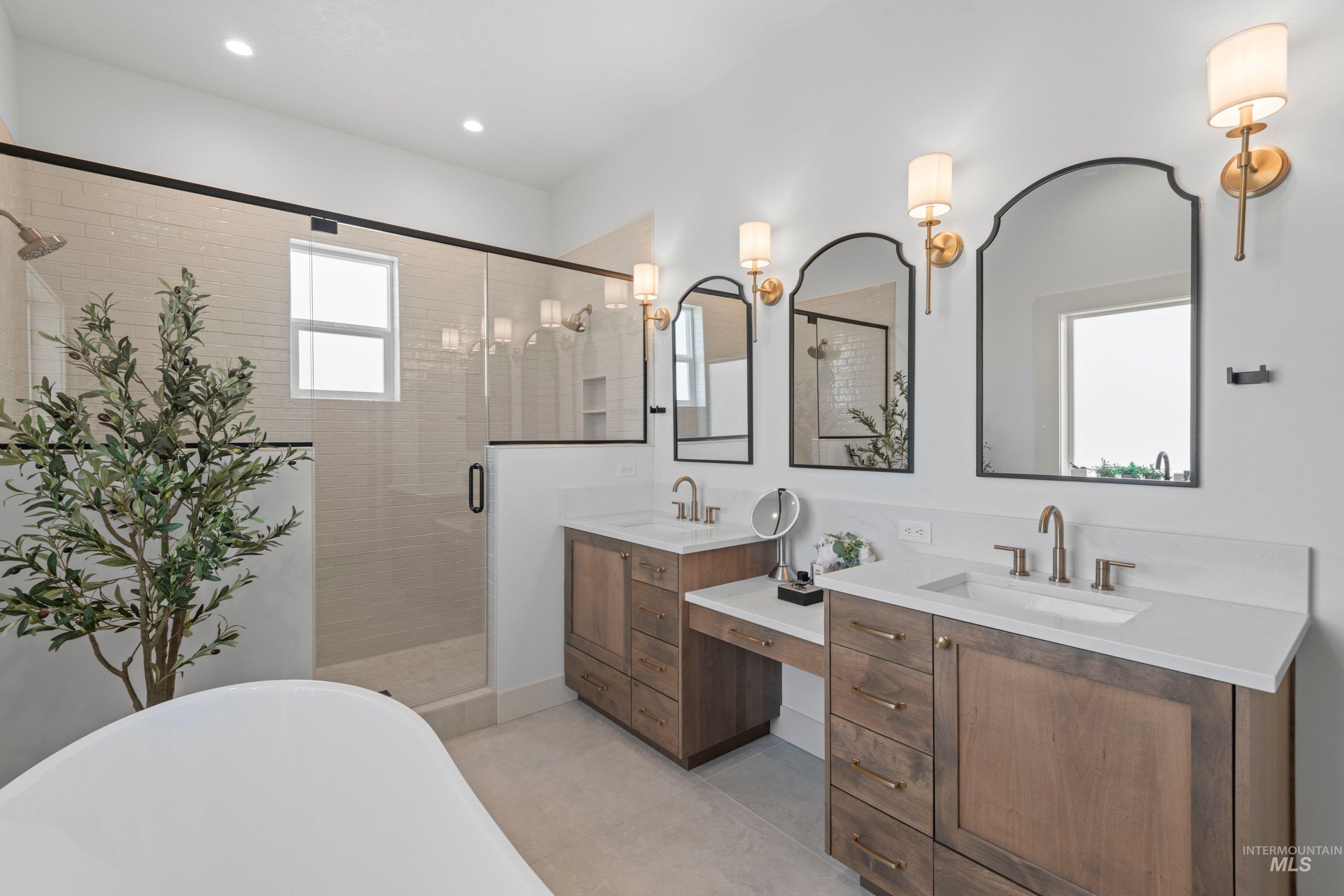24990 Belgian Way Middleton, ID 83644 - Photo 25 of 50 Dual vanity with integrated dressing table, undermount sinks, and light-toned countertops