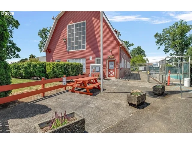 a view of a swimming pool with a lounge chair