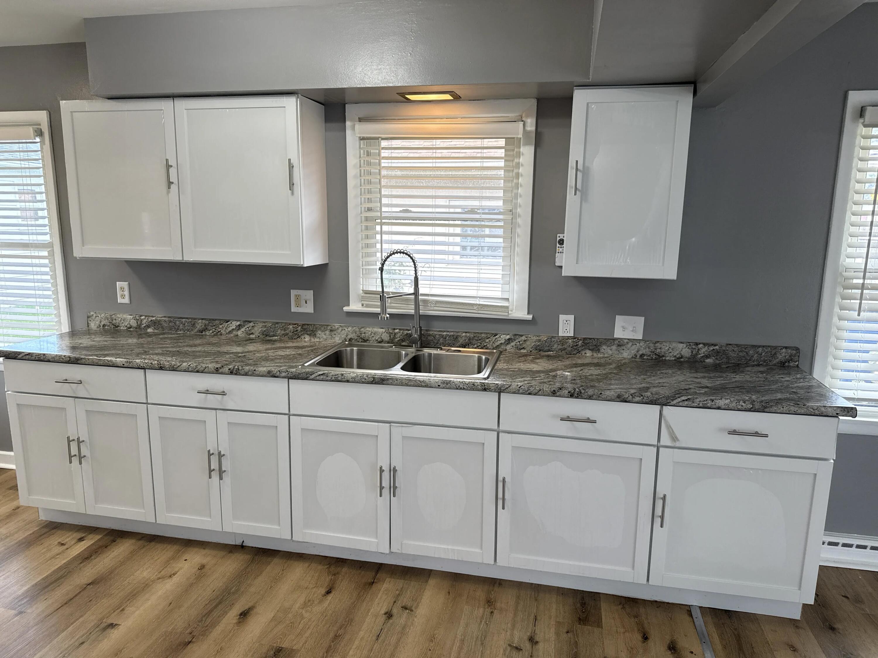 3800 Lasalle Street Racine, WI 53402 - Photo 23 of 74 Brand-new, never-used kitchen cabinets with protective plastic still on, plus a new countertop.