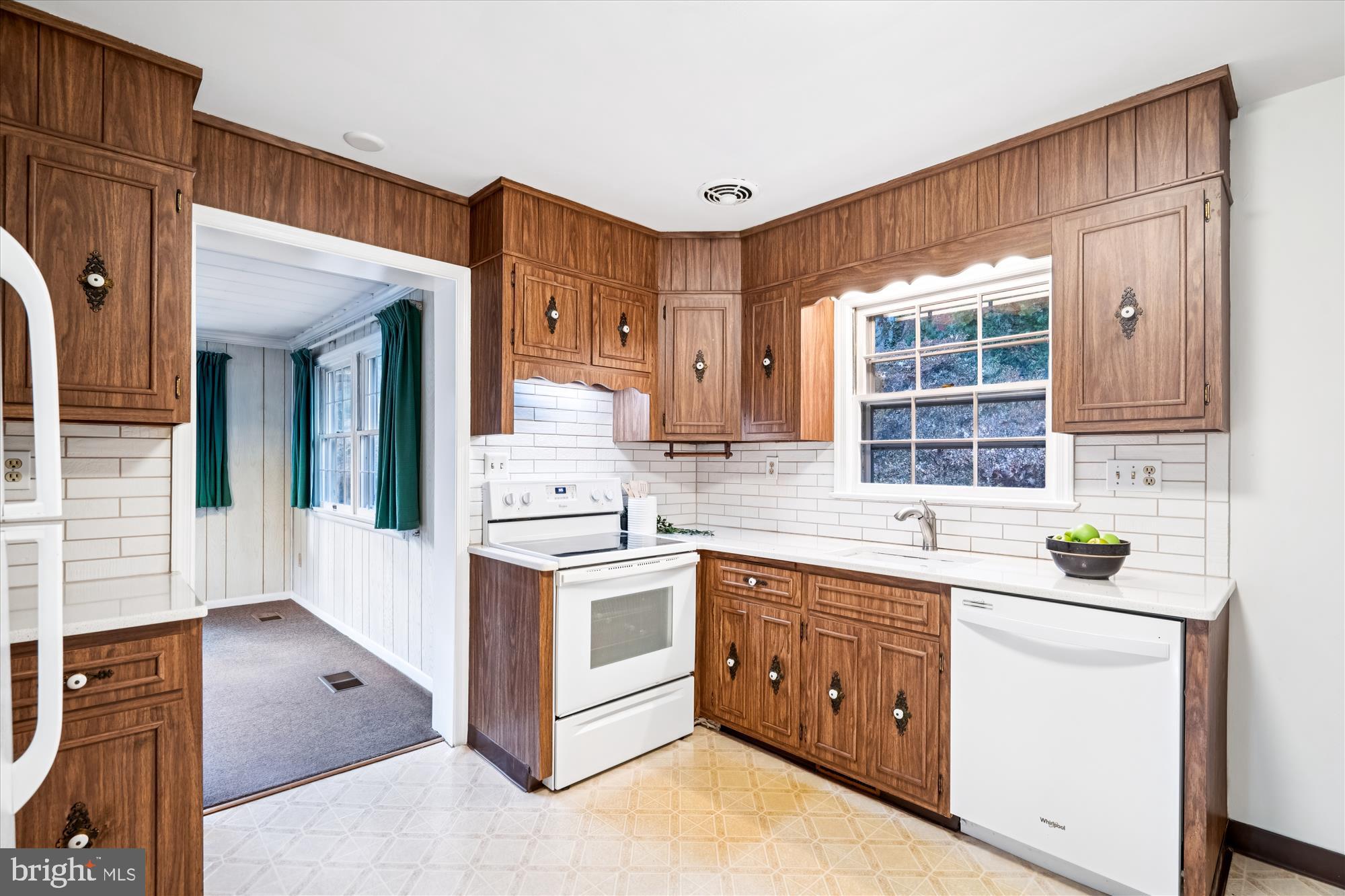 1912 Kimberly Road Silver Spring, MD 20903 - Photo 12 of 45 a kitchen with stainless steel appliances granite countertop a stove and a sink