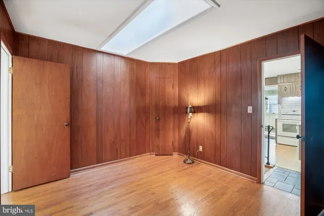 an empty room with wooden floor