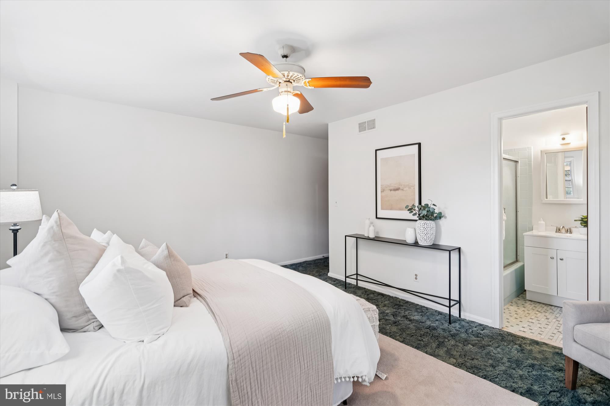 1912 Kimberly Road Silver Spring, MD 20903 - Photo 18 of 45 a bedroom with a bed and cabinets